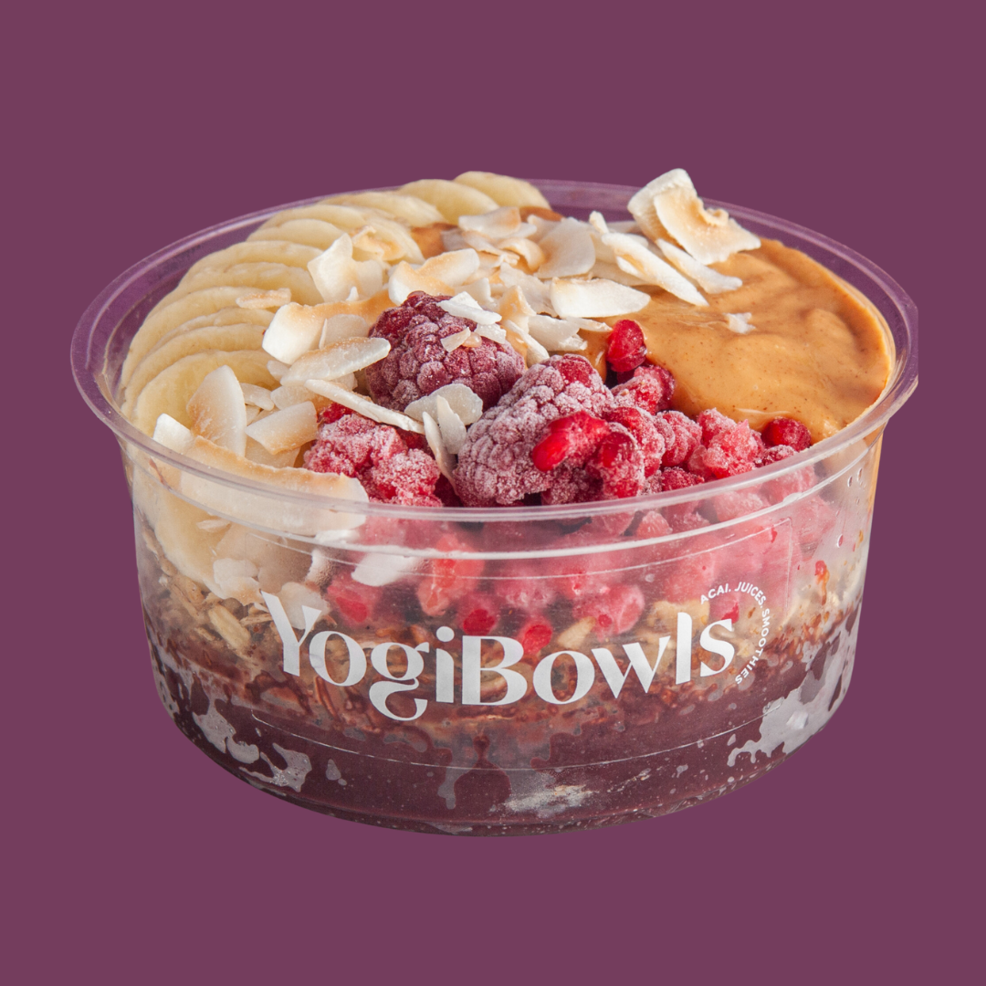 The Classic menu - Açai topped with House Granola, Banana, Frozen Raspberries, Peanut Butter, Toasted Coconut Chips