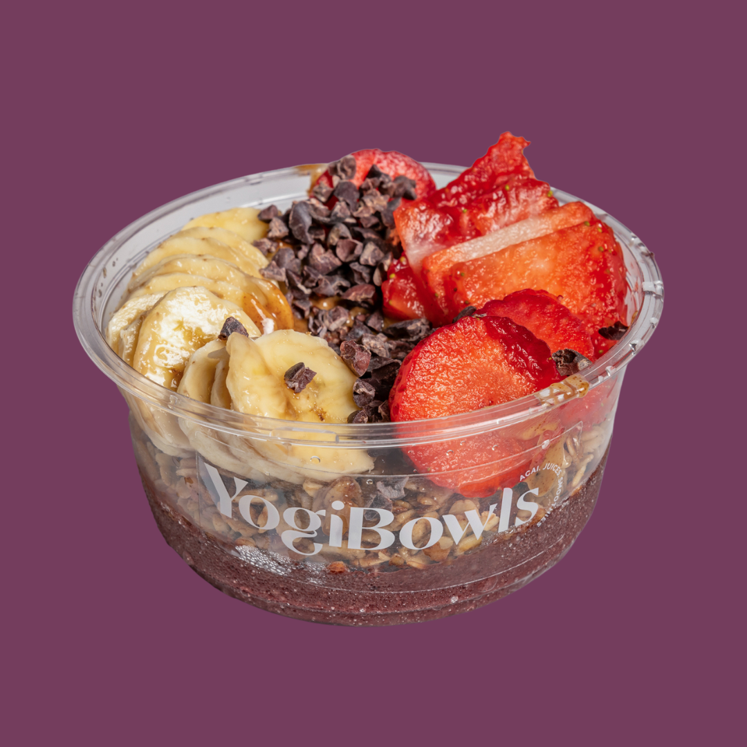 Yogi Bowl menu - Açai topped with House Granola, Banana, Strawberries, Almond Butter, Cacao Nibs